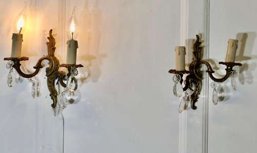 A pair of French Brass Twin Wall Lights The lights are in the classical style