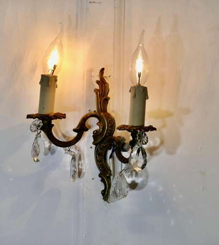 A pair of French Brass Twin Wall Lights The lights are in the classical style