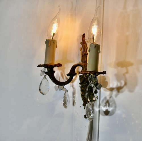 A pair of French Brass Twin Wall Lights The lights are in the classical style