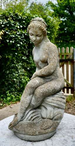 Old Weathered Statue of the Goddess Tyche Holding a Snake