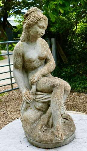 Old Weathered Statue of the Goddess Tyche Holding a Snake