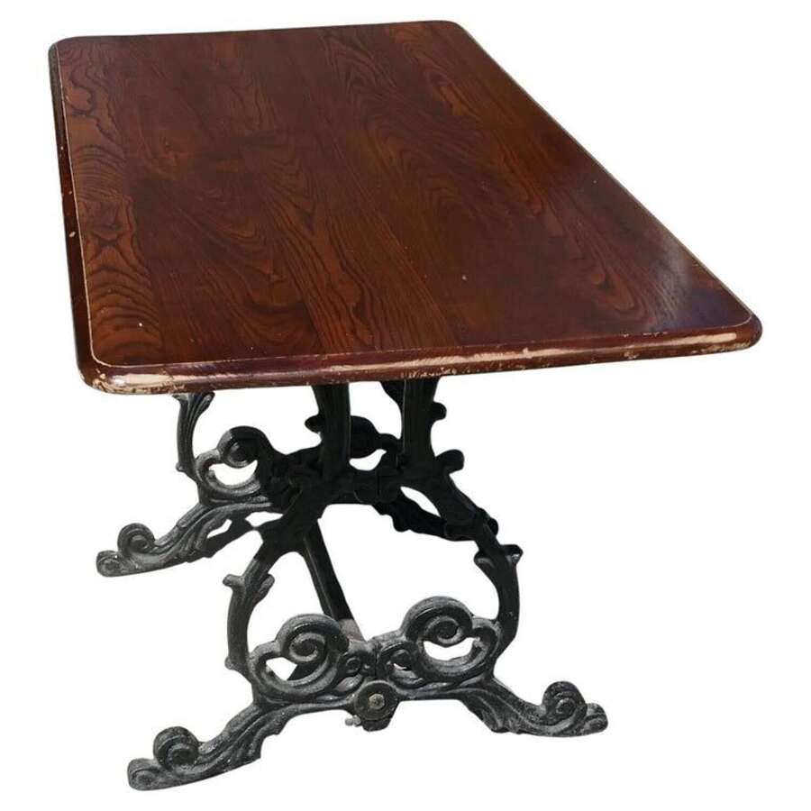 Strong Attractive Cast Iron and Oak Garden Table   This lovely table stands on an elaborat