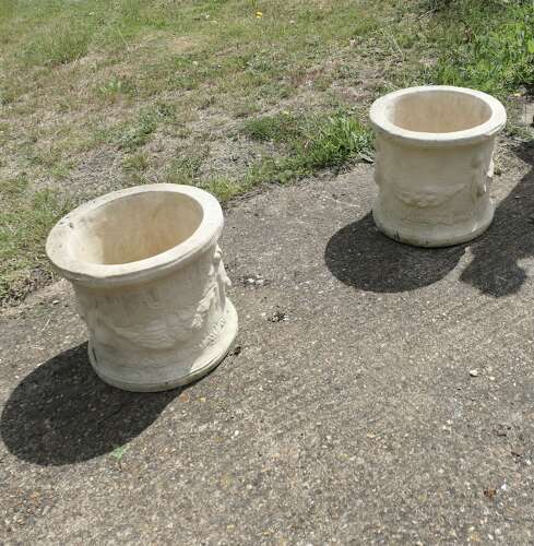 A Pair of Round Garden Planters with Winged Cherubs  This is a good large pair