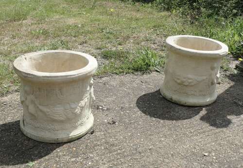 A Pair of Round Garden Planters with Winged Cherubs This is a good large pair