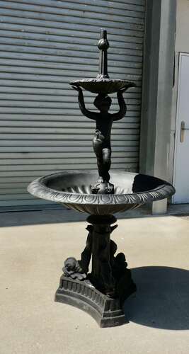 Black Cast Iron Fountain with Cherub Boy  A good piece in a classical style with dolphins