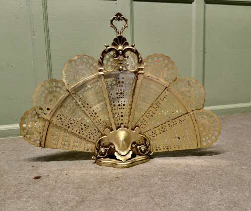 French Folding Brass Fire Screen Peacock’s Tail Fire Guard  This is a very attractive piec