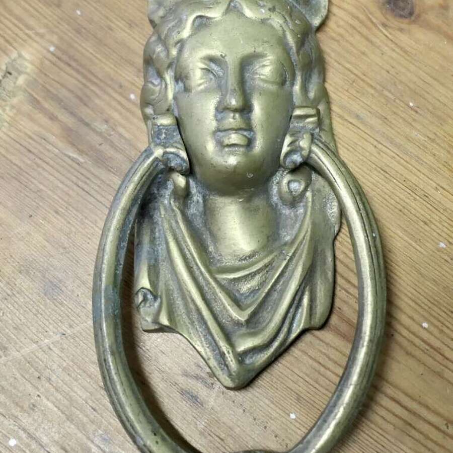 A Victorian Brass Caryatid Door Knocker  A Large Victorian Brass door knocker decorated wi