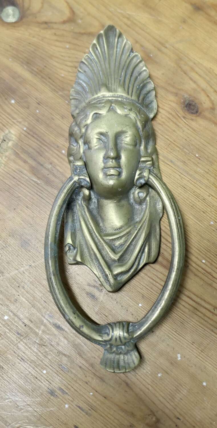 A Victorian Brass Caryatid Door Knocker  A Large Victorian Brass door knocker decorated wi