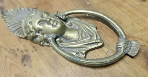 A Victorian Brass Caryatid Door Knocker A Large Victorian Brass door knocker decorated wi