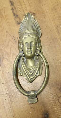 A Victorian Brass Caryatid Door Knocker A Large Victorian Brass door knocker decorated wi
