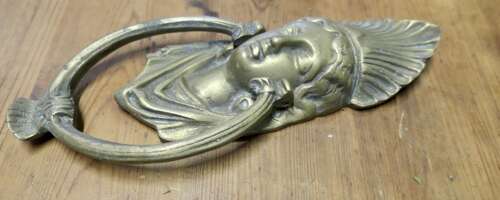A Victorian Brass Caryatid Door Knocker A Large Victorian Brass door knocker decorated wi