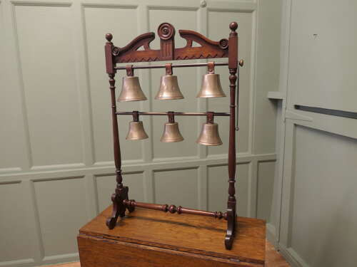 A 19th Century Walnut Rack of 6 Tuned Musical Brass Bells   This is a rare piece the bells