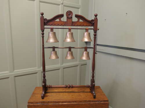 A 19th Century Walnut Rack of 6 Tuned Musical Brass Bells   This is a rare piece the bells