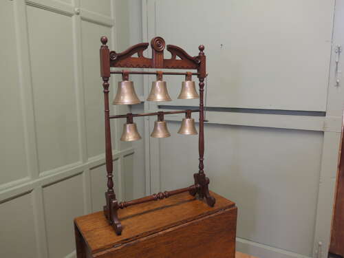 A 19th Century Walnut Rack of 6 Tuned Musical Brass Bells   This is a rare piece the bells