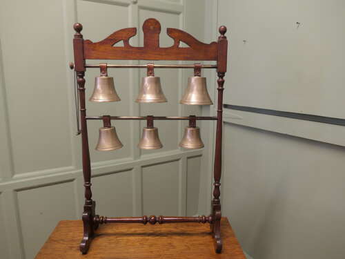 A 19th Century Walnut Rack of 6 Tuned Musical Brass Bells   This is a rare piece the bells