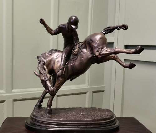 French Bronze Sculpture, Polo Player on Horse Back  A bronze sculpture of a polo player mo