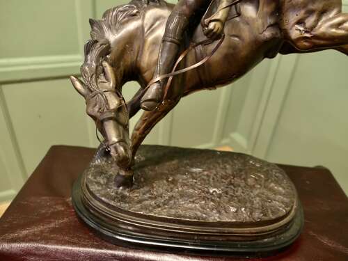 French Bronze Sculpture, Polo Player on Horse Back  A bronze sculpture of a polo player mo