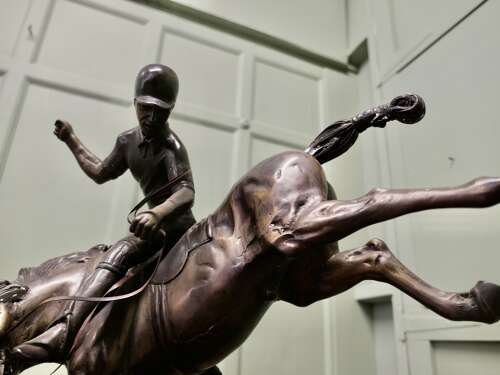 French Bronze Sculpture, Polo Player on Horse Back  A bronze sculpture of a polo player mo