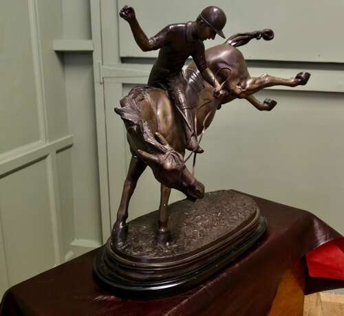 French Bronze Sculpture, Polo Player on Horse Back  A bronze sculpture of a polo player mo