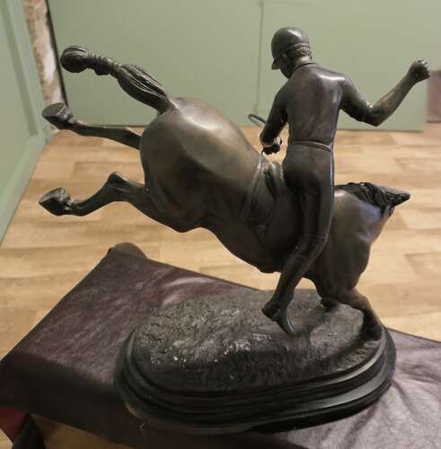 French Bronze Sculpture, Polo Player on Horse Back  A bronze sculpture of a polo player mo