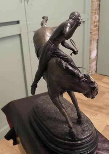 French Bronze Sculpture, Polo Player on Horse Back  A bronze sculpture of a polo player mo