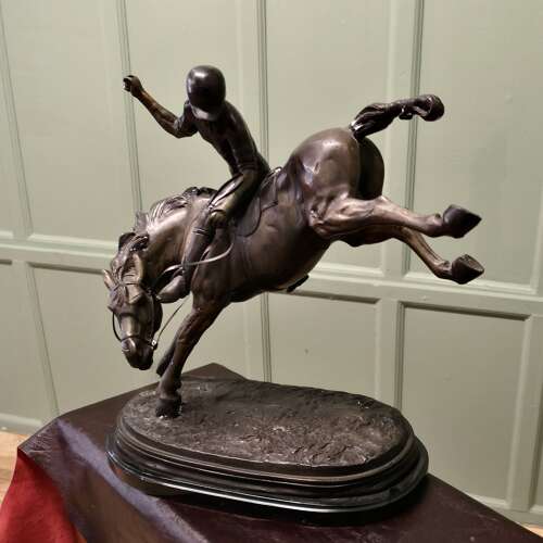 French Bronze Sculpture, Polo Player on Horse Back  A bronze sculpture of a polo player mo