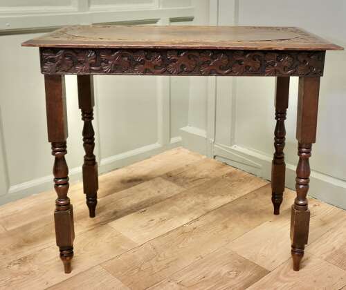 Elm Side Table with Celtic Carvings  This is a good solid table, the top is thick and it h
