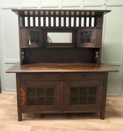 Arts & Crafts Oak Sideboard by Leonard Wyburd for Liberty & Co.  This piece is being offer