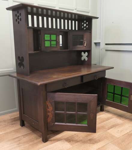 Arts & Crafts Oak Sideboard by Leonard Wyburd for Liberty & Co. This piece is being offer