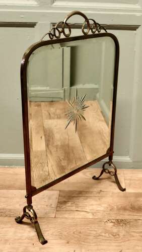 A Fine Quality Art Deco Brass and Sunburst Mirror Fire Screen This is a decorative Fire S